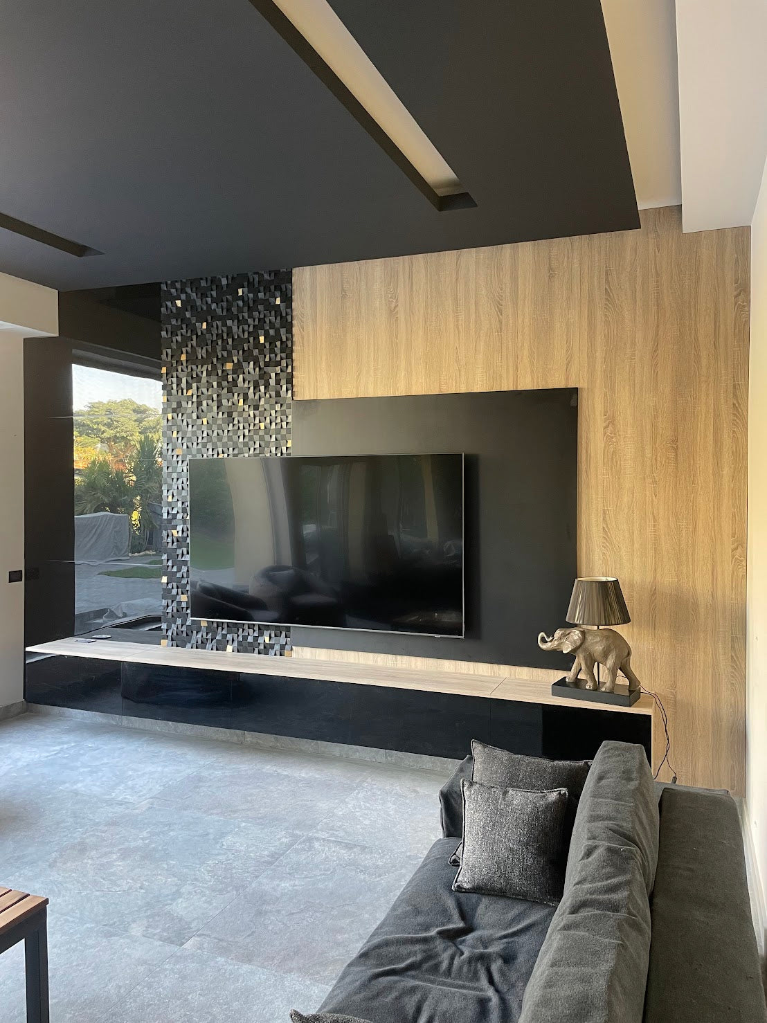 Custom made TV unit with Woodeometry art work